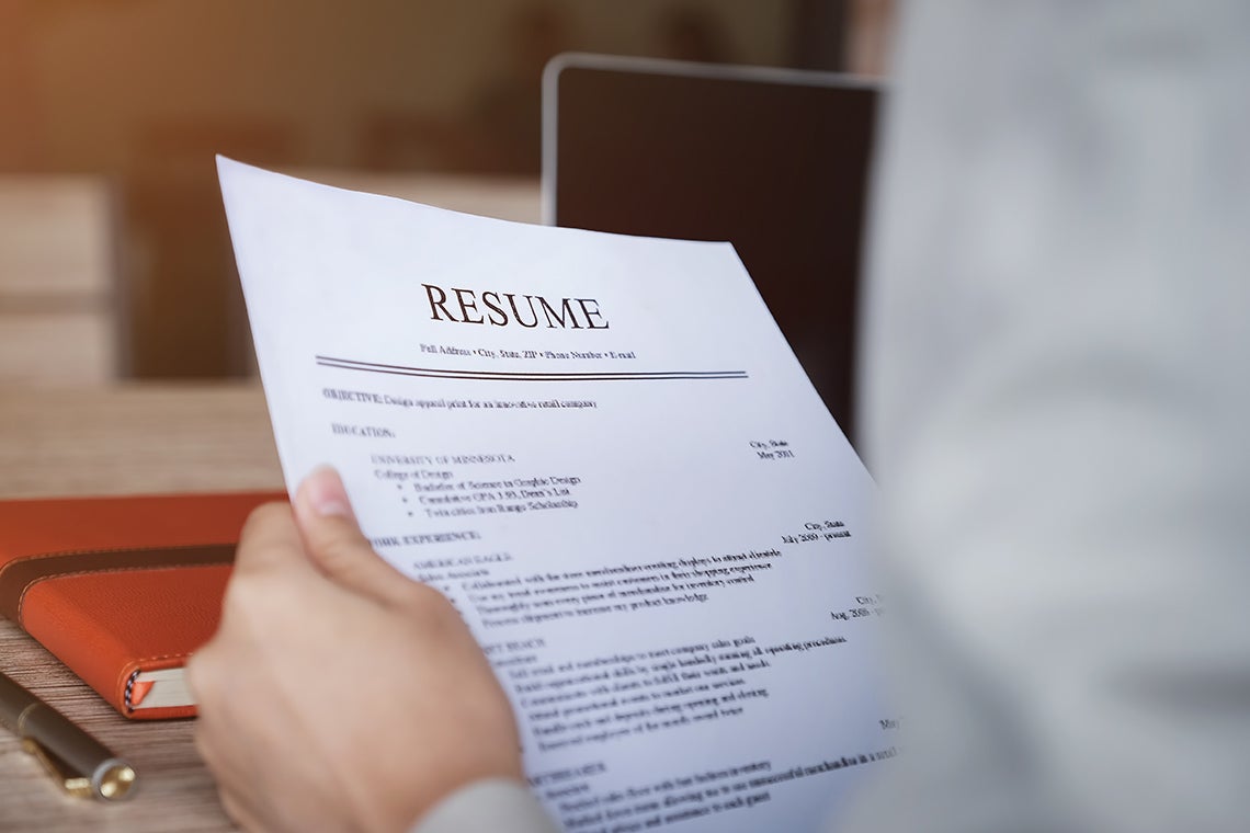 person holding a resume