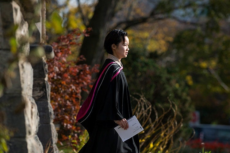 Grad with leaves in background