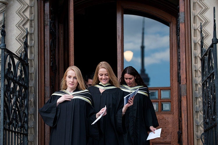 Grads leaving UC with CN Tower in background