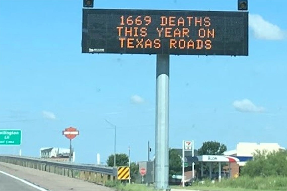 Highway sign in texas reads "1669 deaths this year on texas roads"