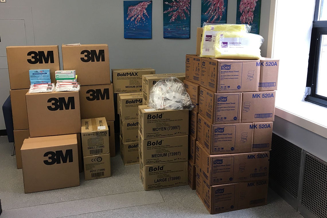 stacks of boxes full of personal protective equipment collected by UTSC