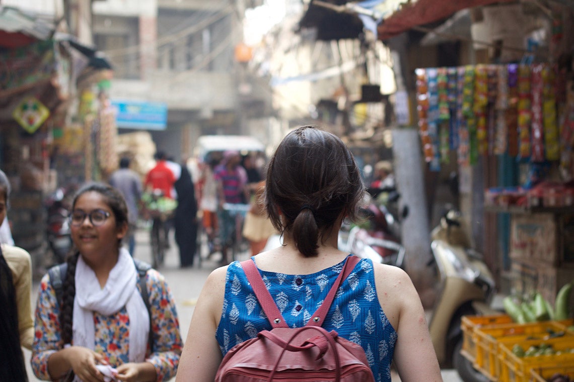 Photo of a student walking in a market