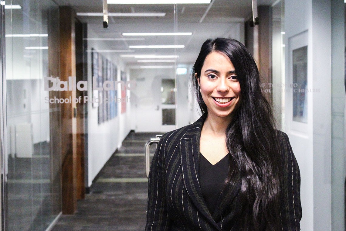 Portrait of Jasleen Ameja taken in a hallway at Dalla Lana