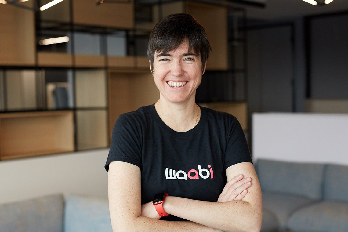 A portrait of Raquel Urtasun with her arms crossed, wearing a Waabi T-shirt