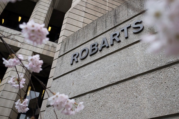 Photo of Robarts library and cherry blossoms