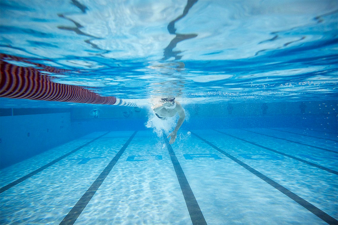 An underwater view of a swimmer in the pool at the University of Toronto's Athletic Centre 