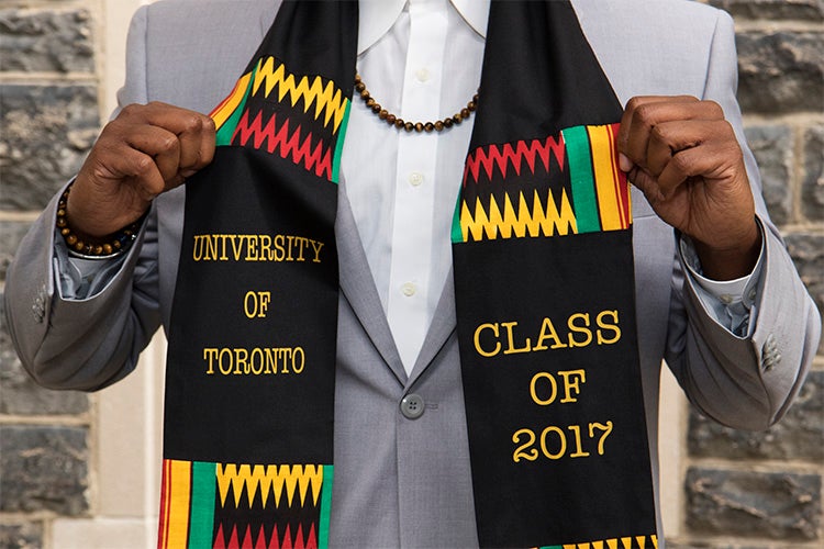 a person at the 2017 black graduation shows of his black graduation scarf