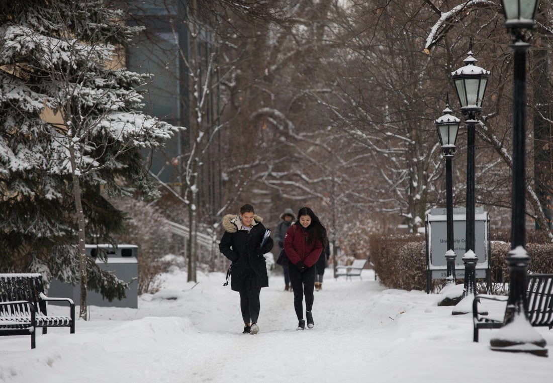 Students walk through the Sir Daniel Wilson quad in the winter.