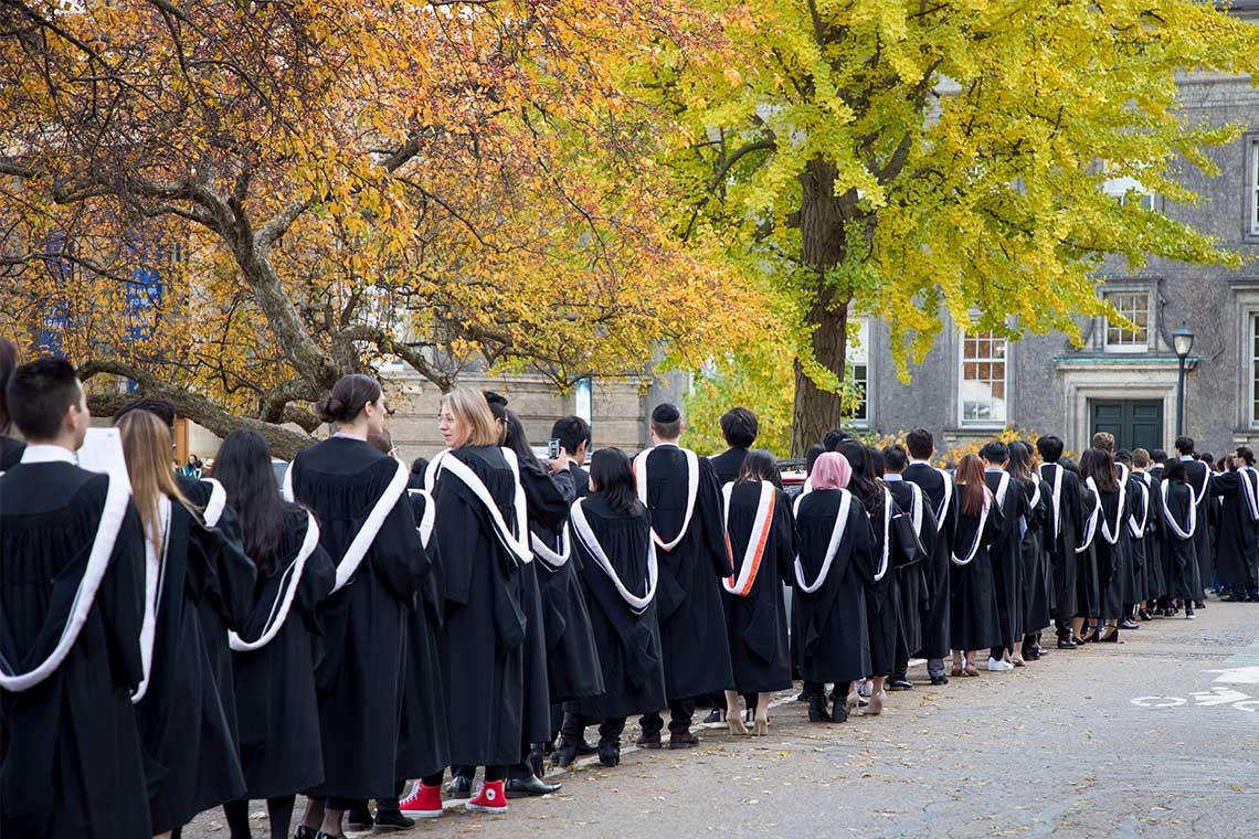 Students line up for fall convocation outside of convocation hall