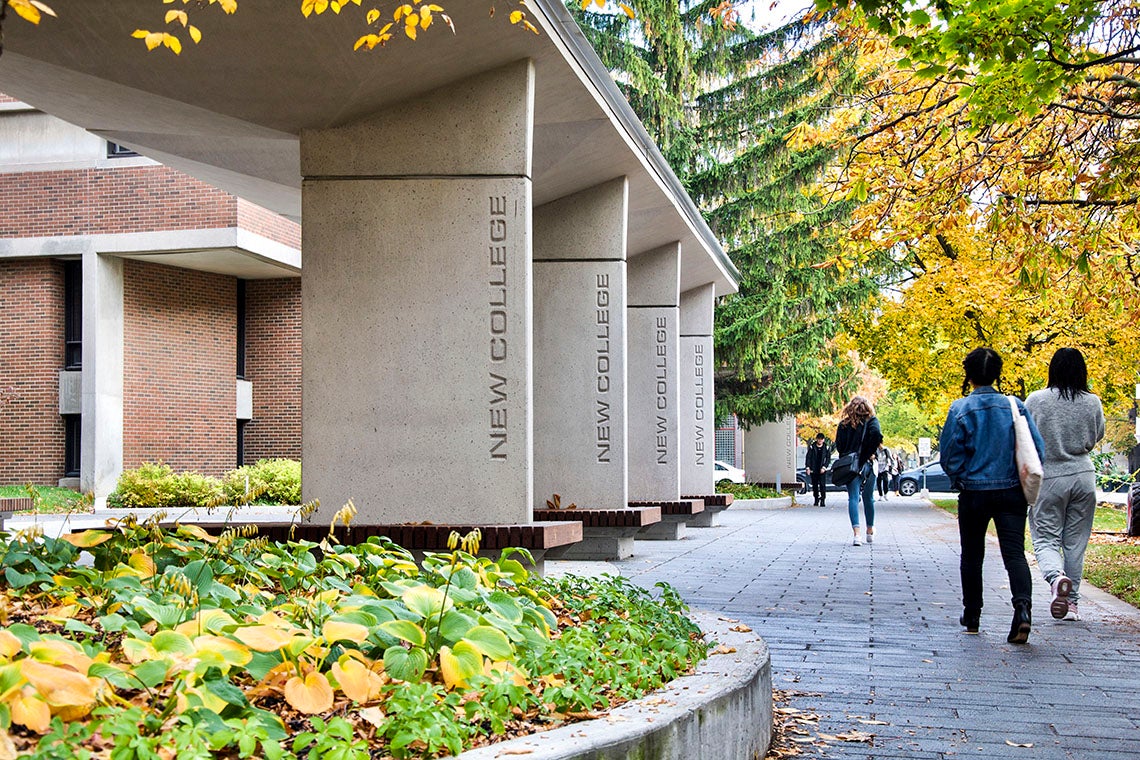 Students walking in front of New College at the University of Toronto St. George campus