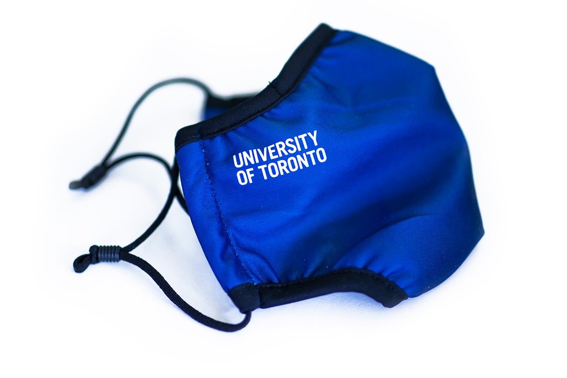 photo of a blue face mask with "University of Toronto" printed on the side