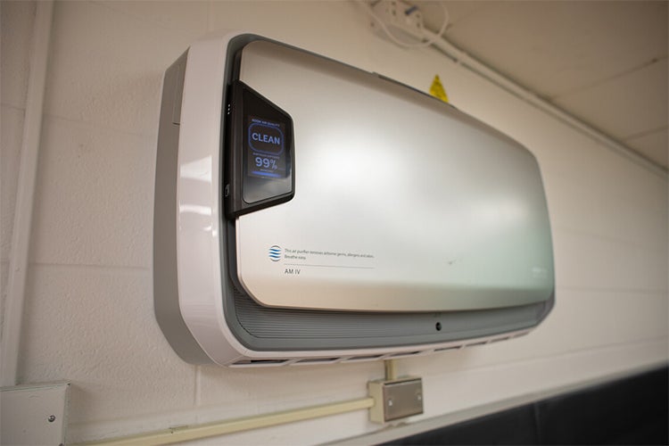 Wall-mounted air purifier in a classroom