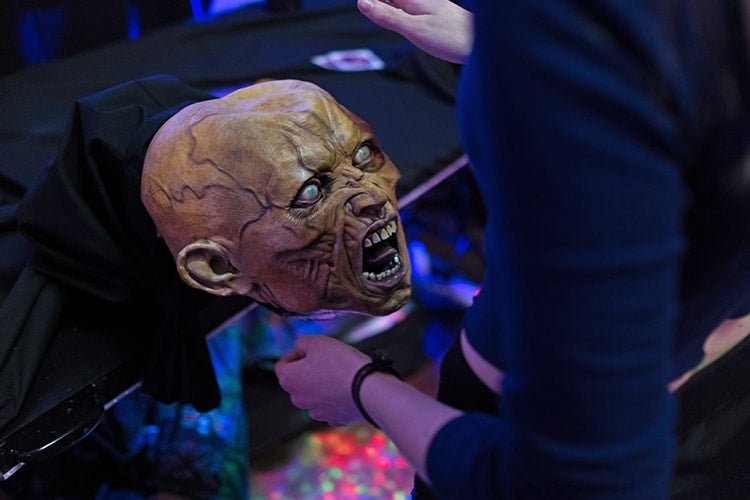 A photo of a zombie head controller for the game Disco Is Dead