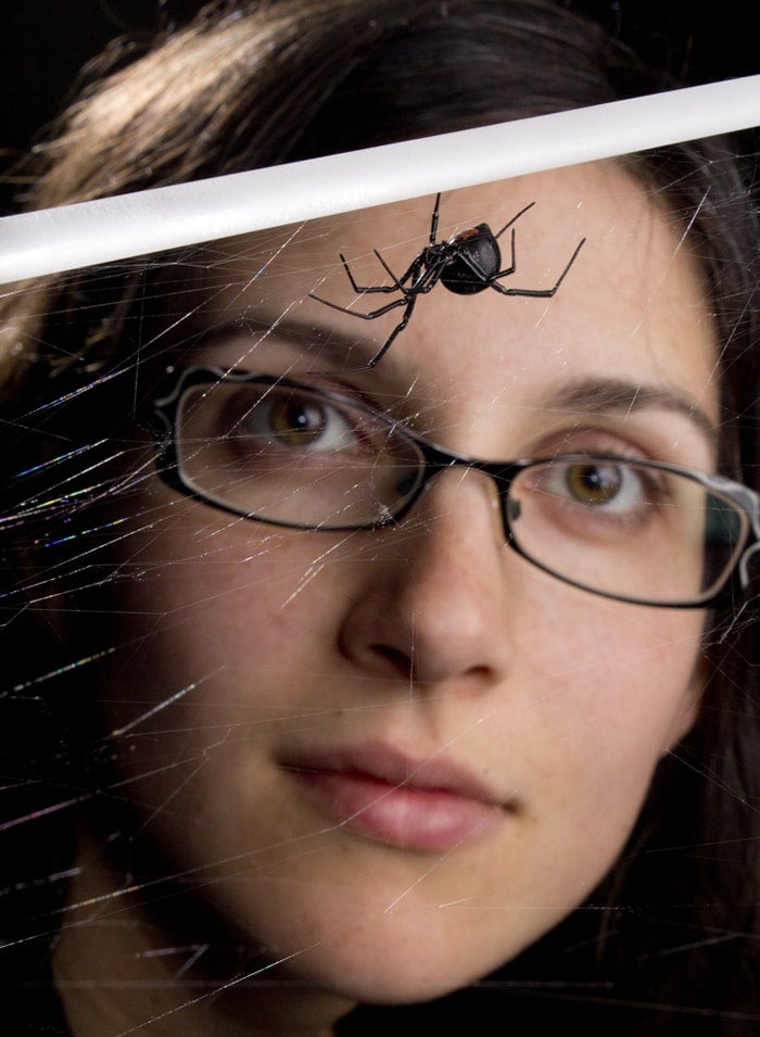 photo of student looking at spider