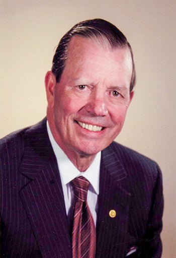 headshto of tony comper
