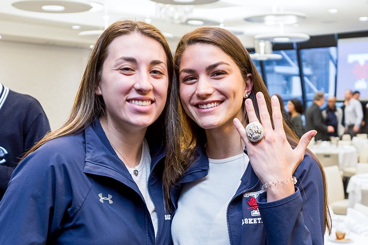 Ellen Ougrinov and Fiorella Granda try on the championship ring