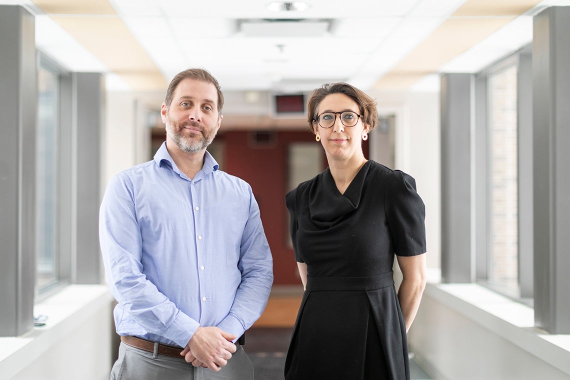 Robert Kozak and Samira Mubareka stand in a hallway