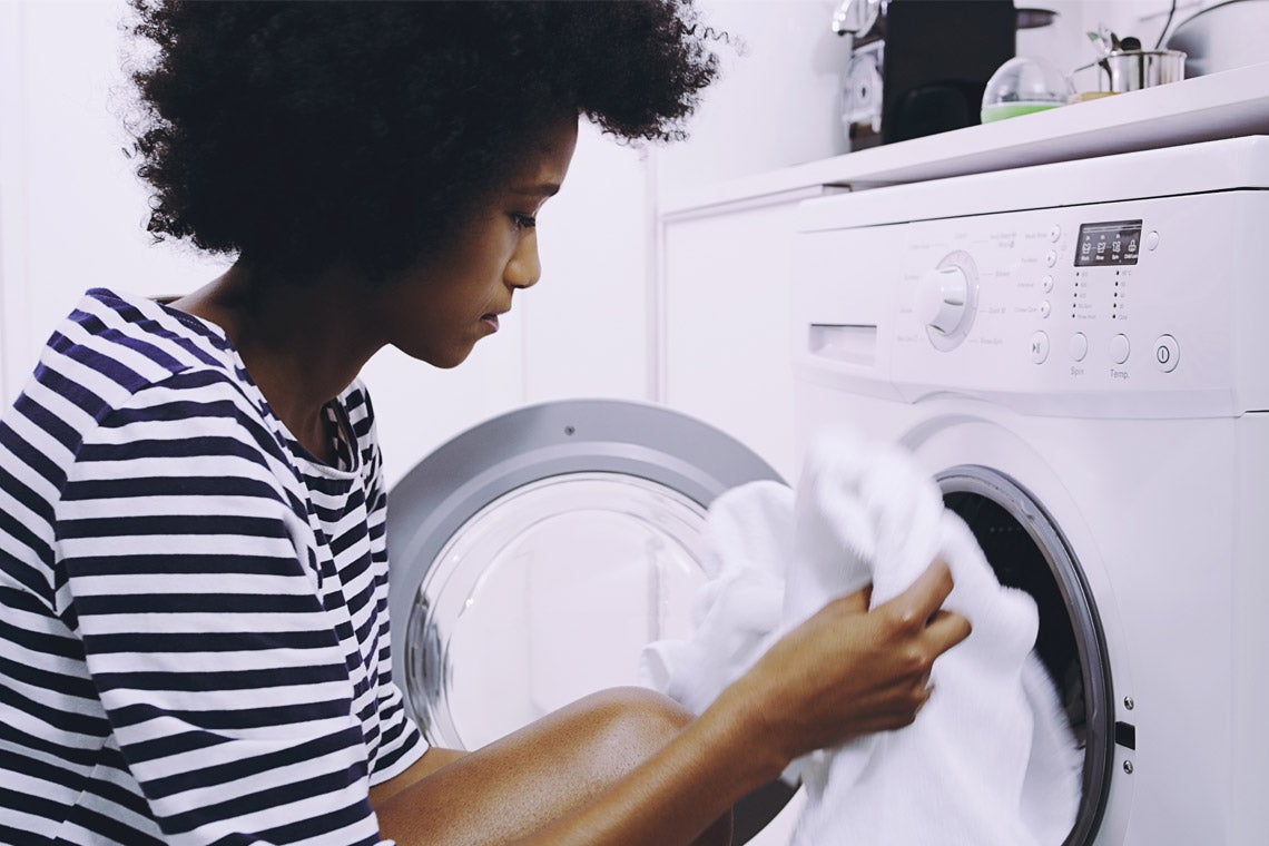 photo of a woman doing laundry