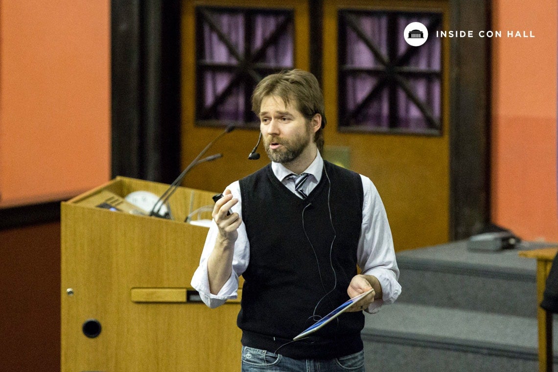 Photo of Christian Caron lecturing in Con Hall
