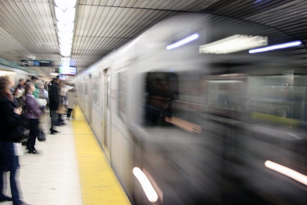 photo of subway train moving so fast it is blurred