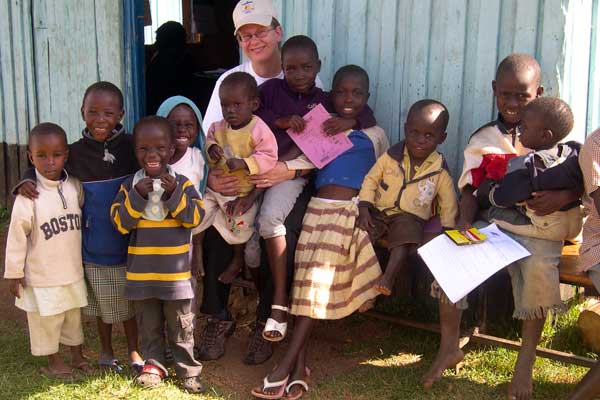 Photo of Associate Professor Paula Braitstein with children at an orphanage in Kenya