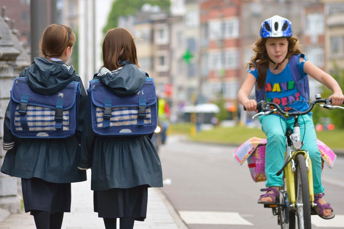 photo from flickr of girls walking and biking
