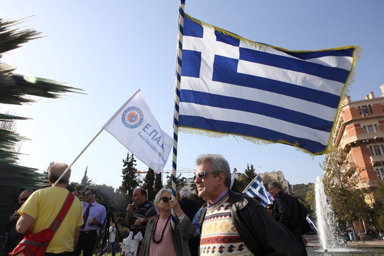 Man holding Greek flag
