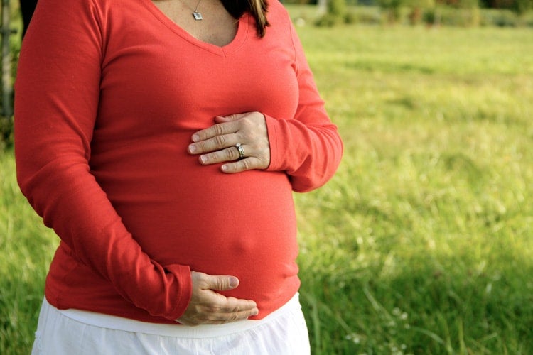 photo of a woman focused on her pregnant belly