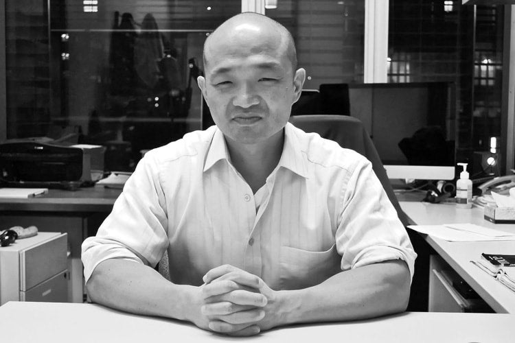 photo of researcher at his desk