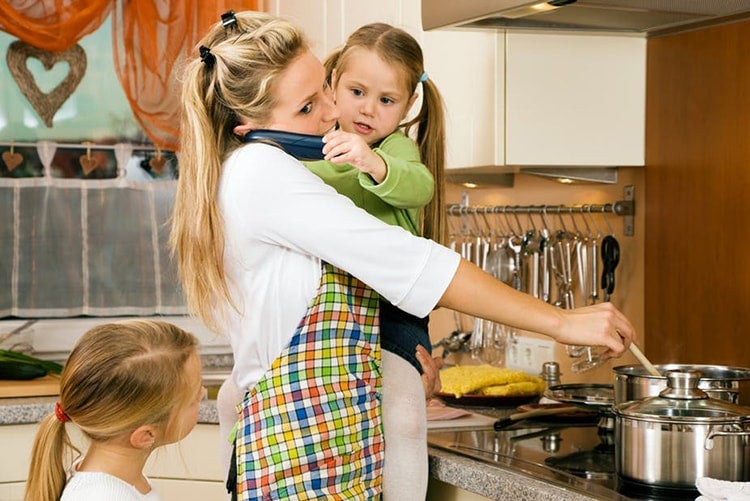 Photo of woman with children cooking