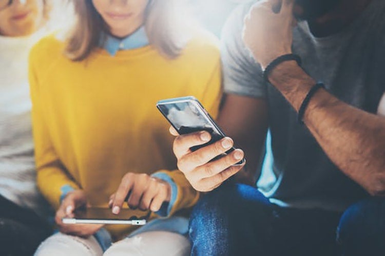 Photo of people on cellphones