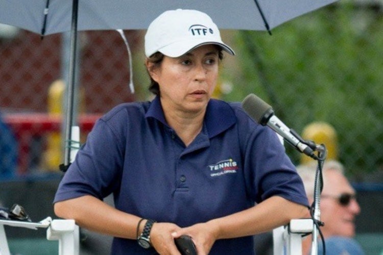 Alison Dias officiating at a tennis match