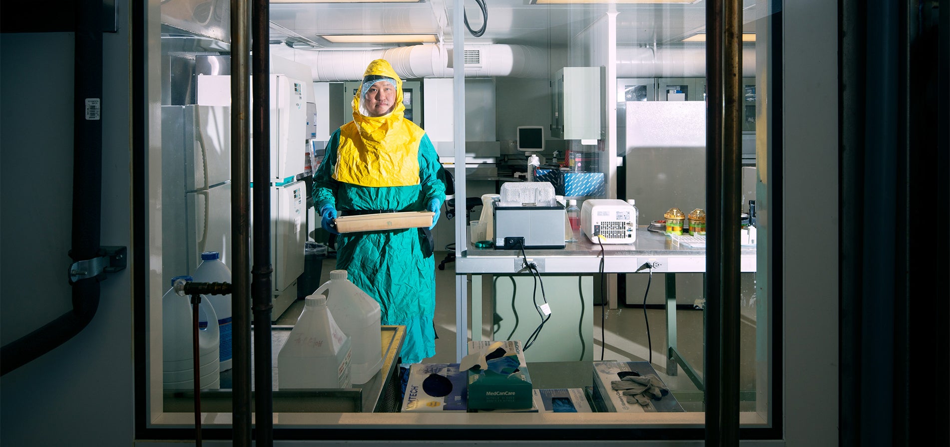 Steven Ahn looks out from working in the Toronto High Containment Facility. Photo by Nathan Cyprys.