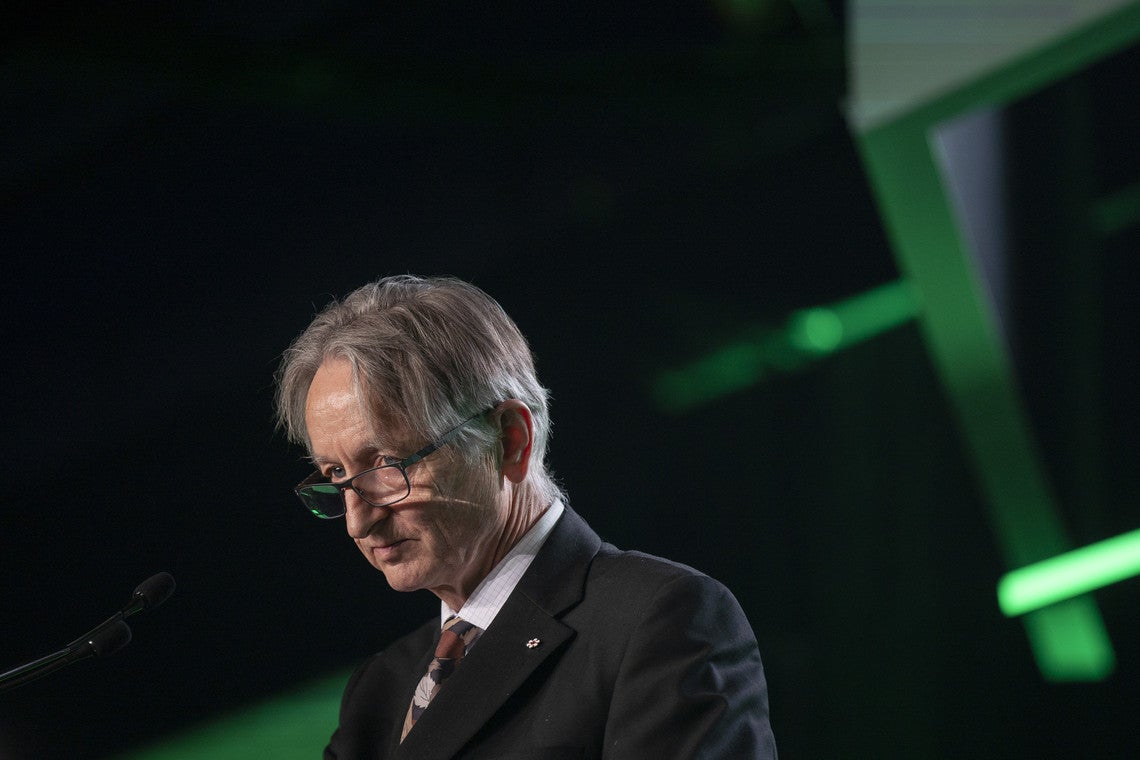 Photo of Geoffrey Hinton speaking on stage