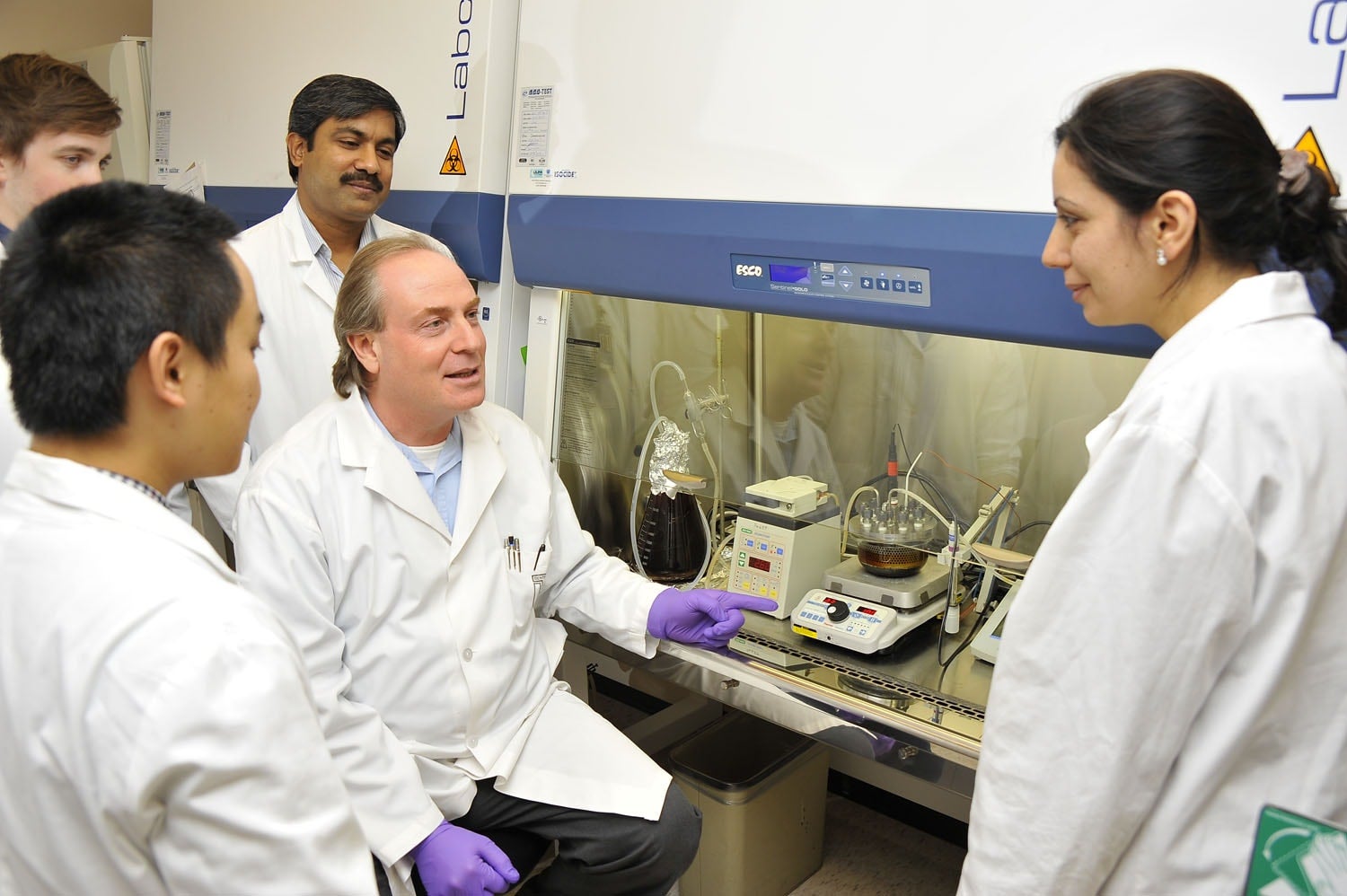 Professor and students in lab