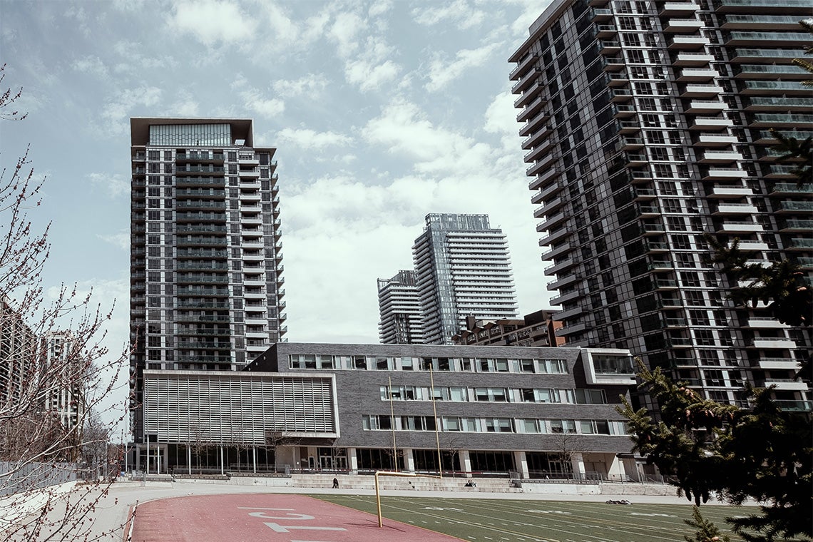 high rise condos built over school, and grounds