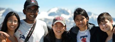 Five U of T students pose in front of mountains.