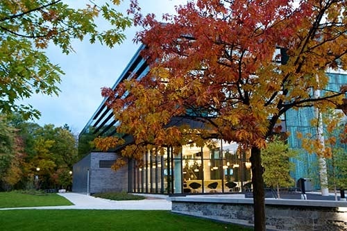 Exterior of UTM campus building, surrounded by fall foliage