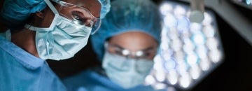two female surgeons in an operating room