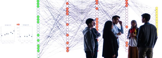 an instructor and students in front of a large visualization screen at the university of toronto