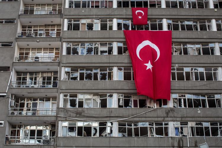 Turkey's flag draped over an abandoned building 