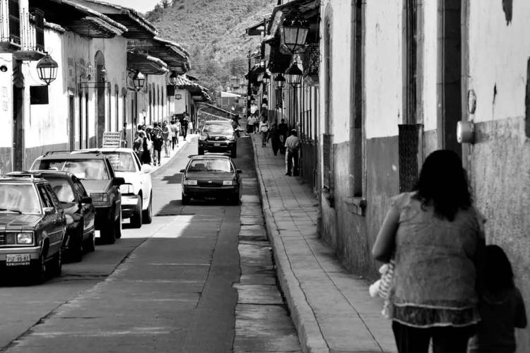 black and white photo of a paved road in Mexico