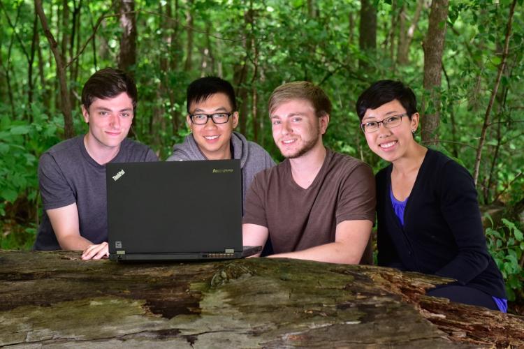 photo of the students with laptop in park