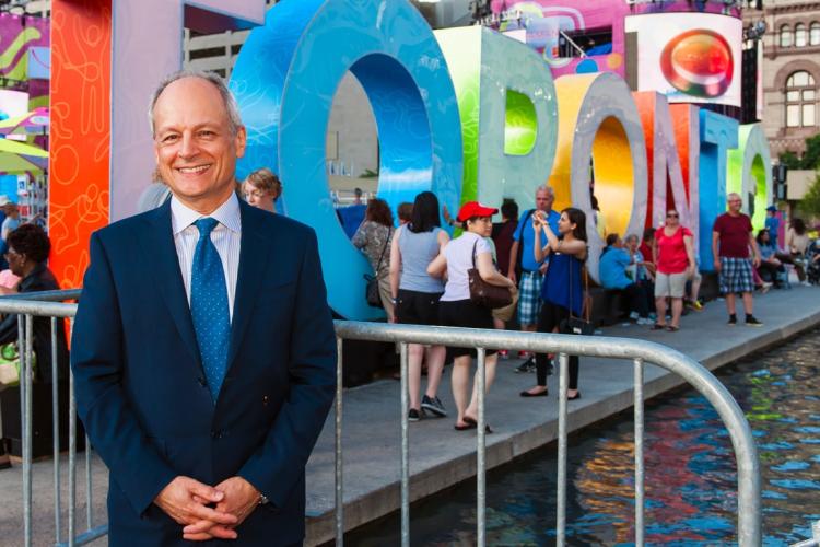 photo of Meric Gertler in front of Toronto sign