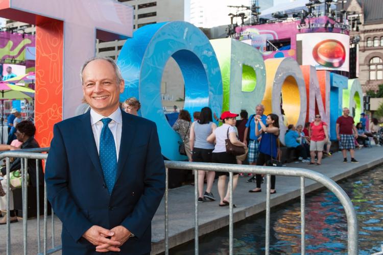 photo of president beside Toronto sign