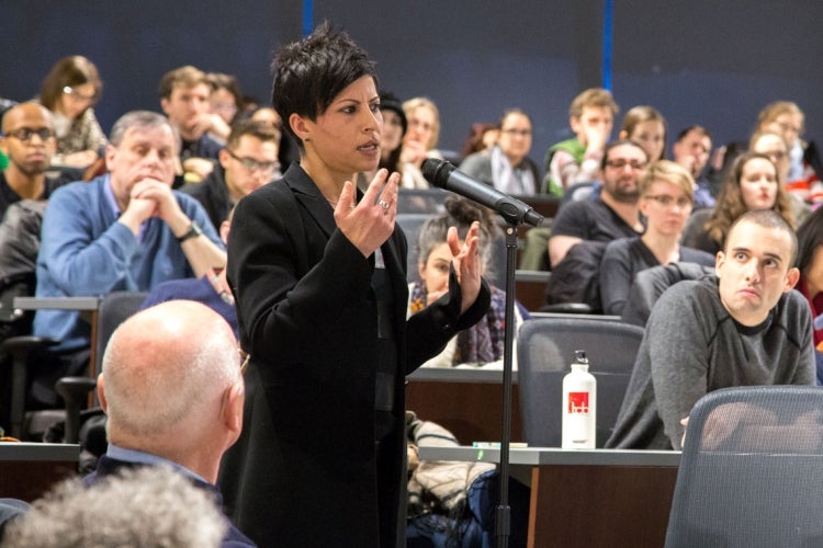 photo of audience members at town hall