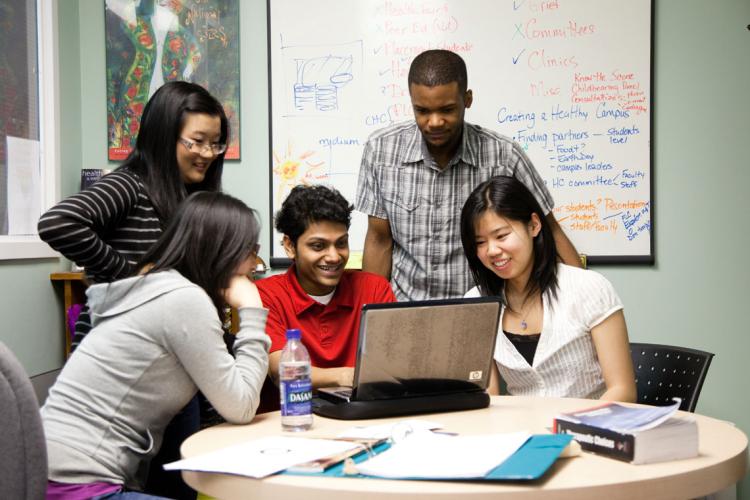 photo of students around a table