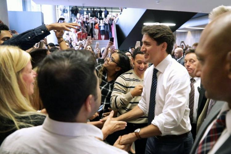 photo of Trudeau greeting crowd of students