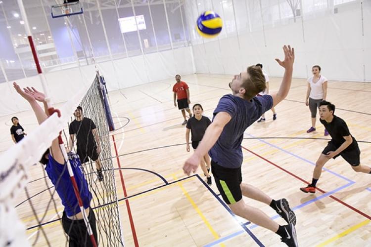 Students playing vollyball 