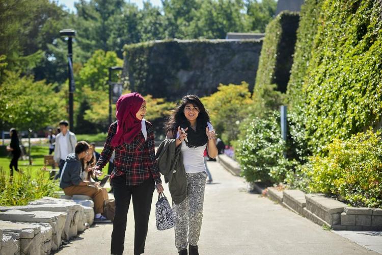 Photo of students waling on campus